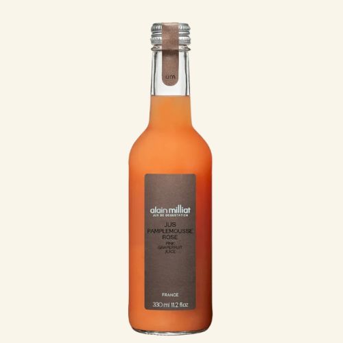 This image shows a bottle of Alain Milliat Pink Grapefruit juice, labeled with the product details, containing 330ml.