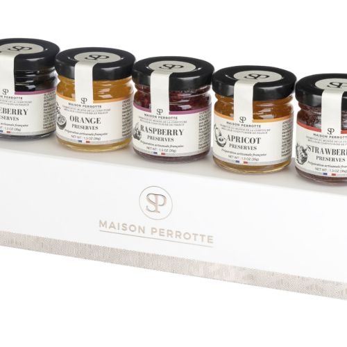 The image shows five small jars of Maison Perrotte preserves, featuring blackberry, orange, raspberry, apricot, and strawberry flavors on a white box.