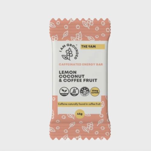 This image shows a wrapper for a caffeinated energy bar flavored with lemon, coconut, and coffee fruit, 45g, with illustrations on it.