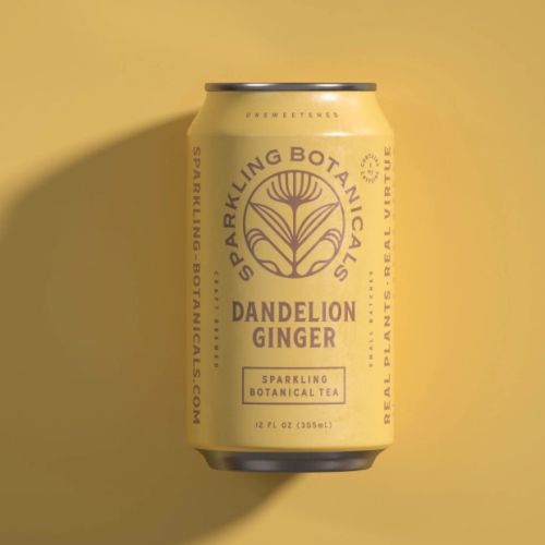This image shows a can of Sparkling Botanicals Dandelion Ginger sparkling botanical tea on a matching yellow background.