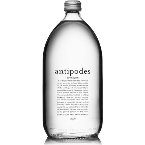 A clear bottle labeled "antipodes" containing sparkling water with text detailing its source and purity on the front.